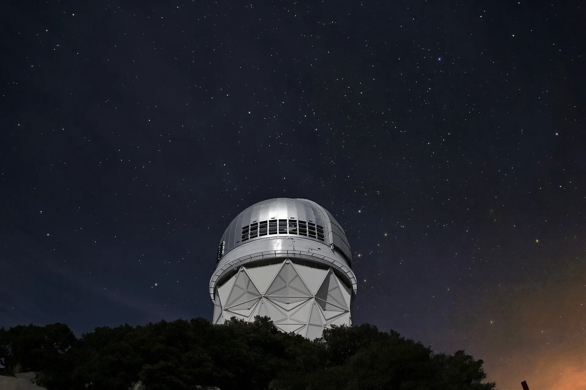 Stars over the Mayall 4-meter telescope at Kitt Peak National Observatory near Tucson, AZ. Arizona vs Utah astronomy tour prices, what each one includes
