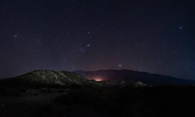 With the camera lens facing east, the panoramic view of this light pollution-free sky reveals an almost perfect firmament between the Pleiades to Canopus, Orion rising in the middle and Sirius looming behind the southernmost mountain. It is the crown of the small point of light that comes from a tow. How to Use a Light Pollution Map to Find Dark Skies in the US